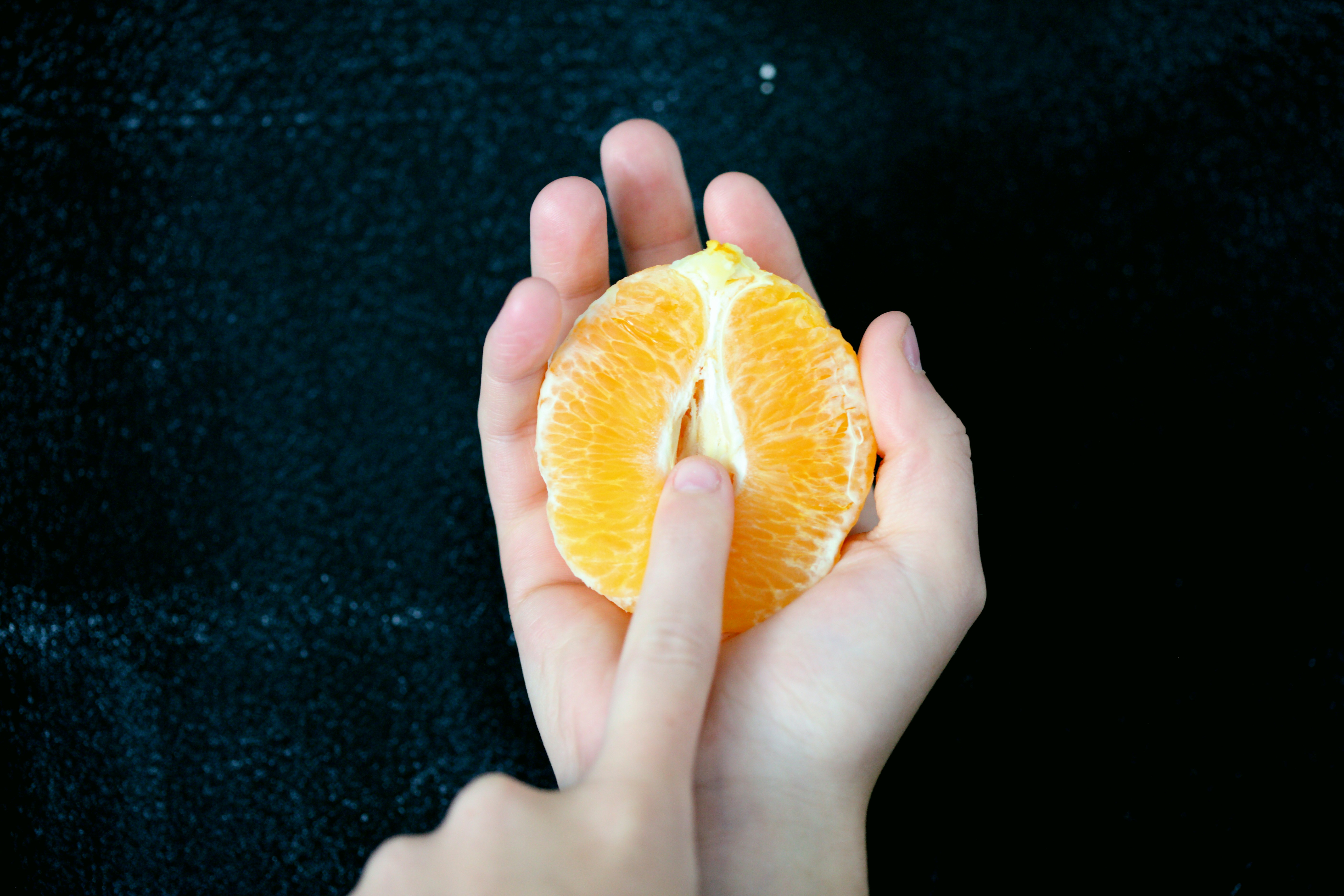 vulvar vestibulitis symptoms represented by an orange sliced open yo