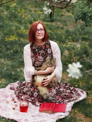 Woman with cat Photo by Maria Lupan on Unsplash