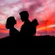 Couple embracing in a pink sunset